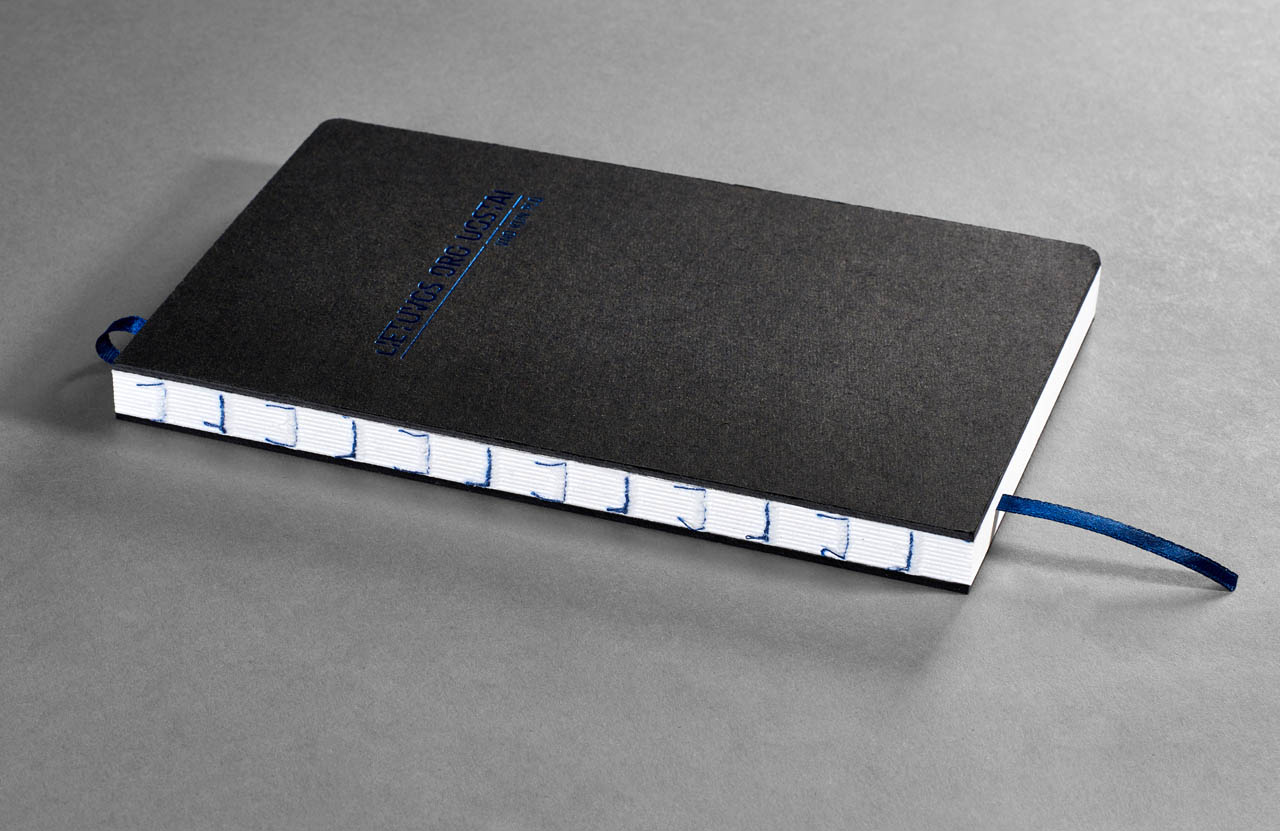 Open spine agenda with blue foil on the cover design by Jurga